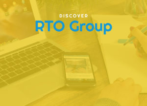 A modern workspace displays RTO Group’s resources on a laptop, smartphone, and notepad.