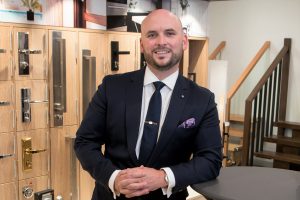 Andrew Shea, CEO of Builders Academy Australia, poses in a showroom.