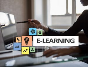A person engages with e-learning on a laptop, demonstrating modern TAE 22B assessment methods.