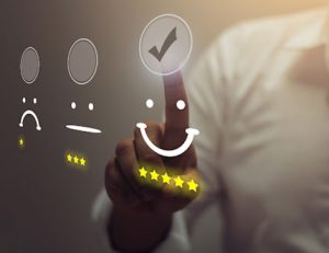 A hand taps a five-star rating on a screen, representing positive customer feedback for RTO consultants.