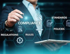 A compliance professional reviews government regulations, ensuring RTO training meets standards.