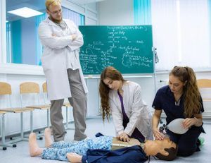 Medical students practice CPR during an RTO training session, demonstrating practical skills.