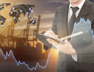 A businessman reviews financial data and logistics, highlighting the need for current RTO training.
