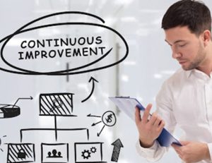 A man reviews planning documents illustrating continuous improvement for effective RTO training.