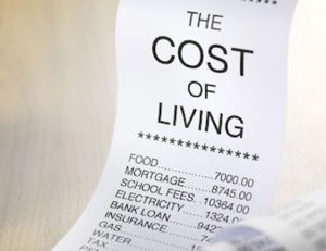 A receipt shows increasing household expenses impacting international students' finances.